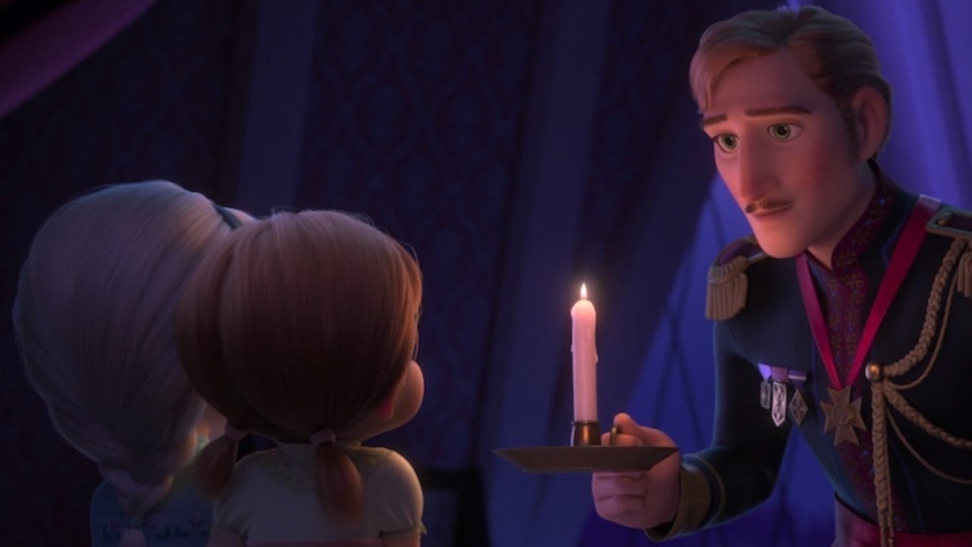 Anna and Elsa with their dad, who is holding a candle 