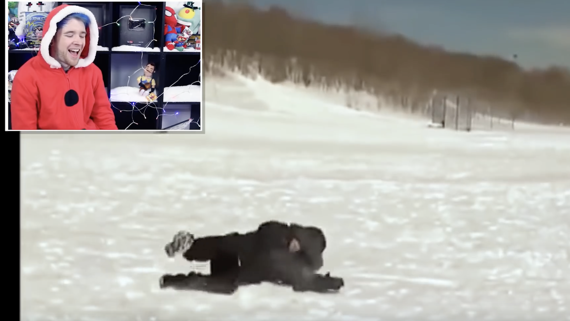 DanTDM watches clips of people falling over in the snow