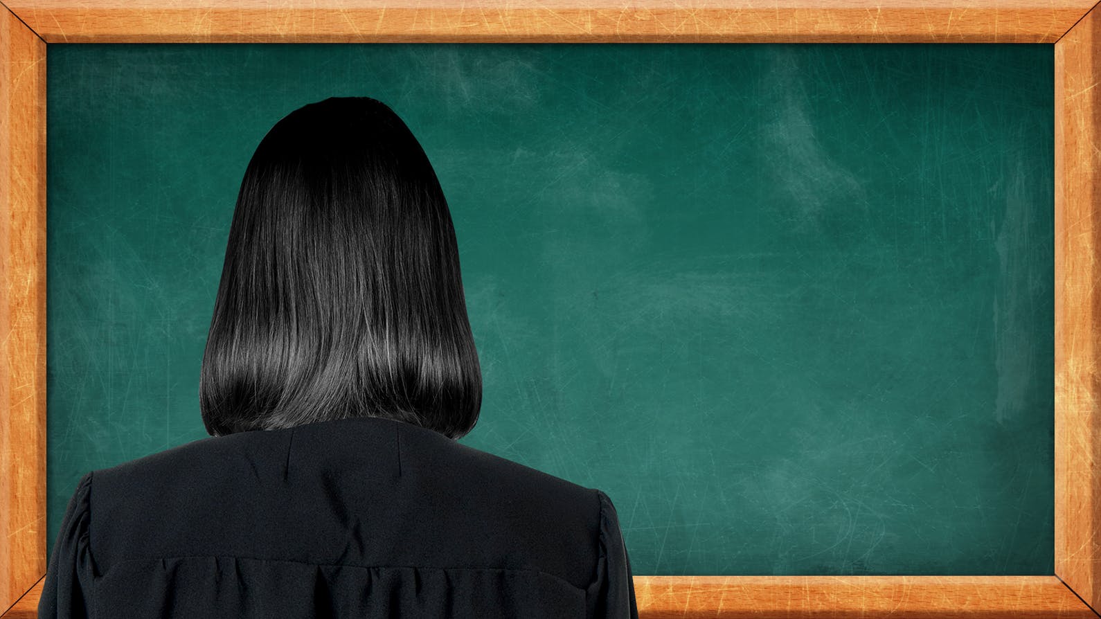 A mysterious teacher standing in front of a chalk board