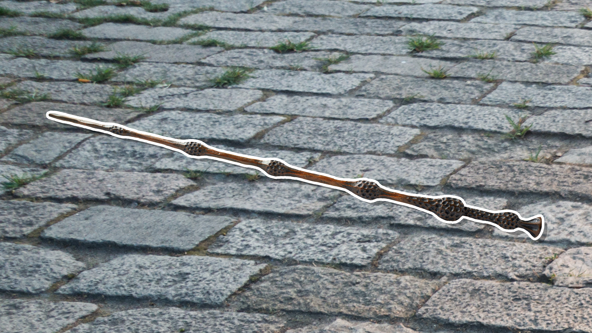 An Elder wand on a cobbled street