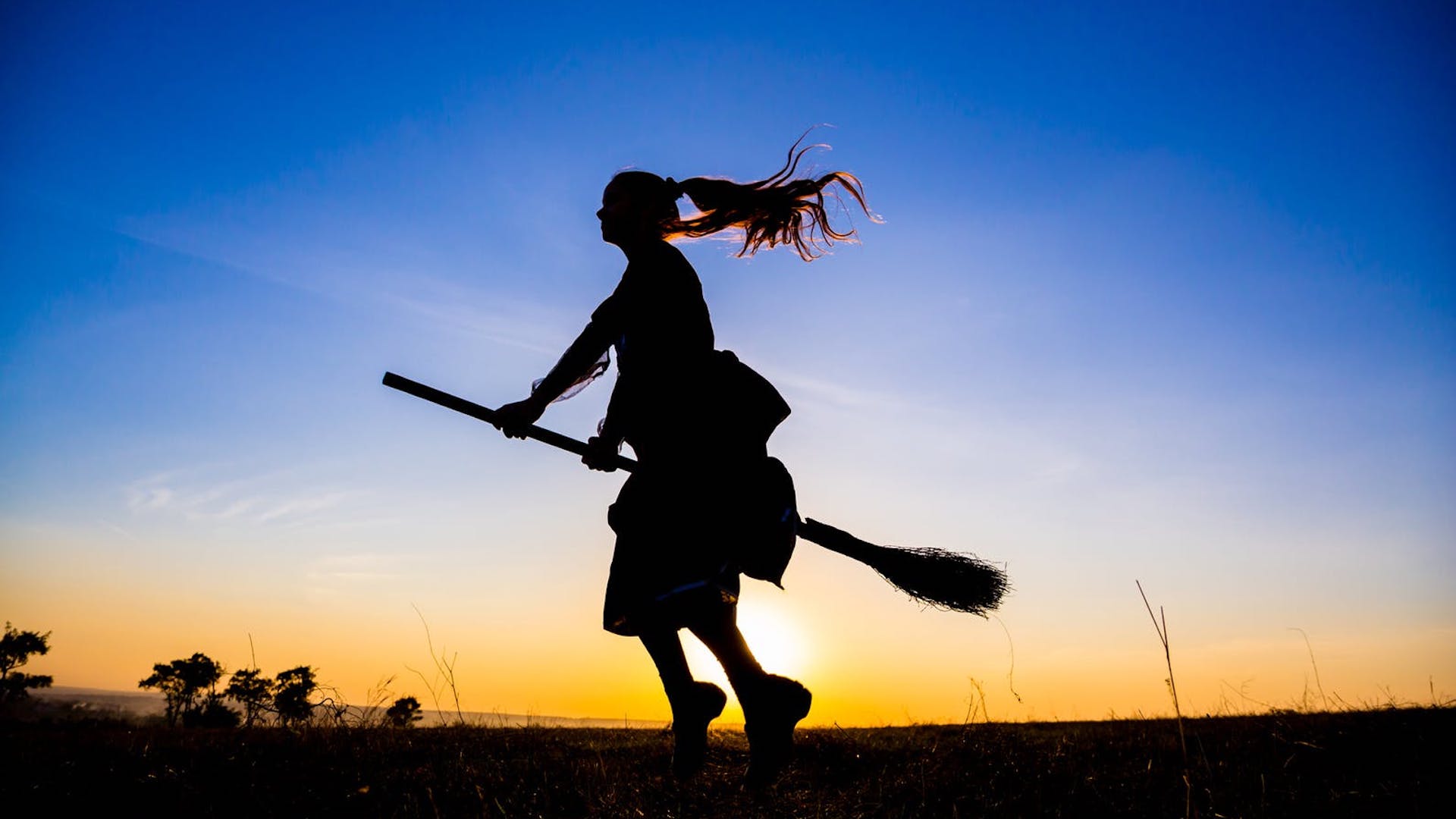 A girl flying on a broomstick