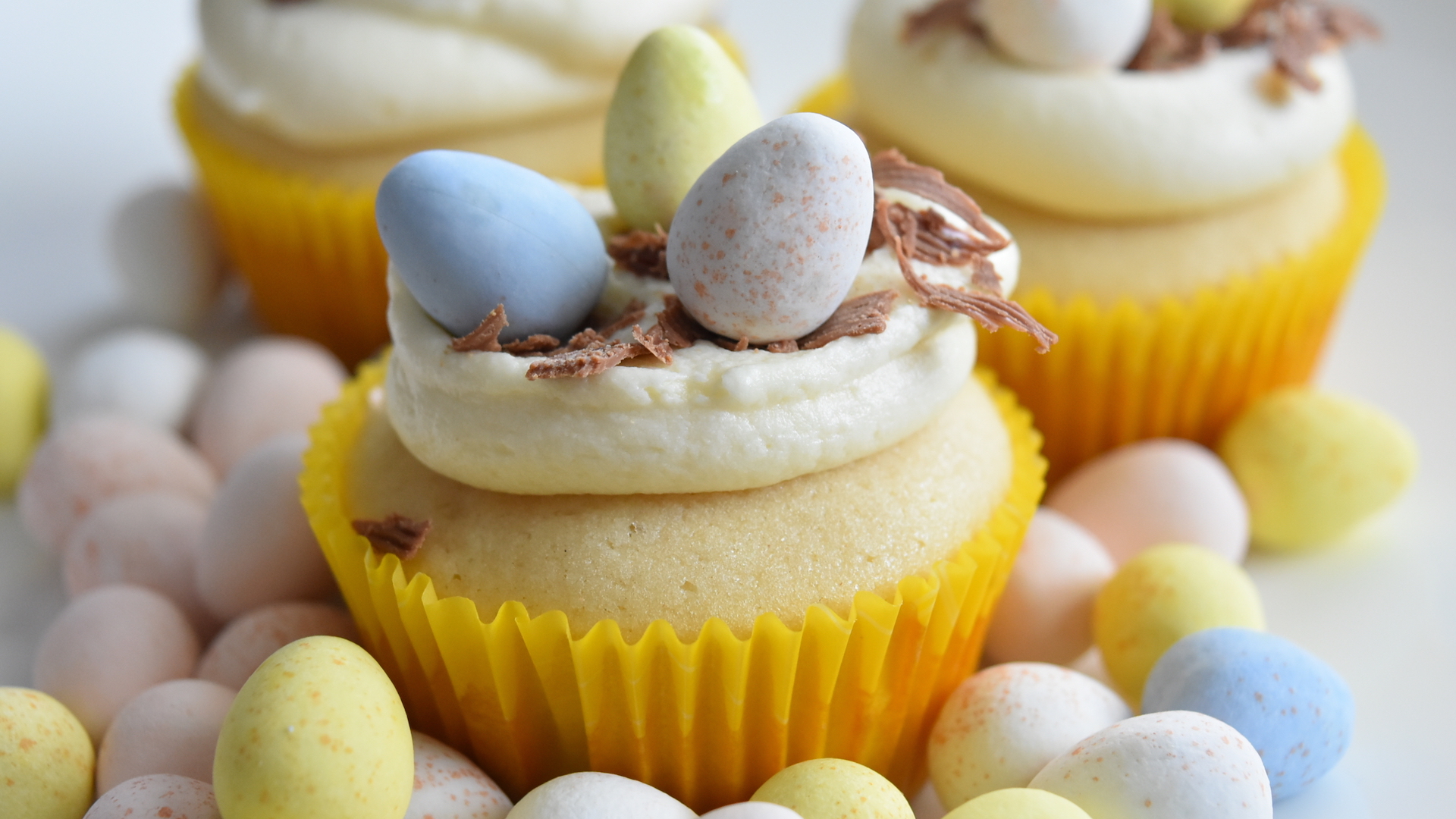 A cupcake decorated with small eggs