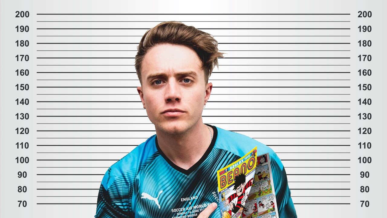 Roman Kemp standing against a height chart with a Beano