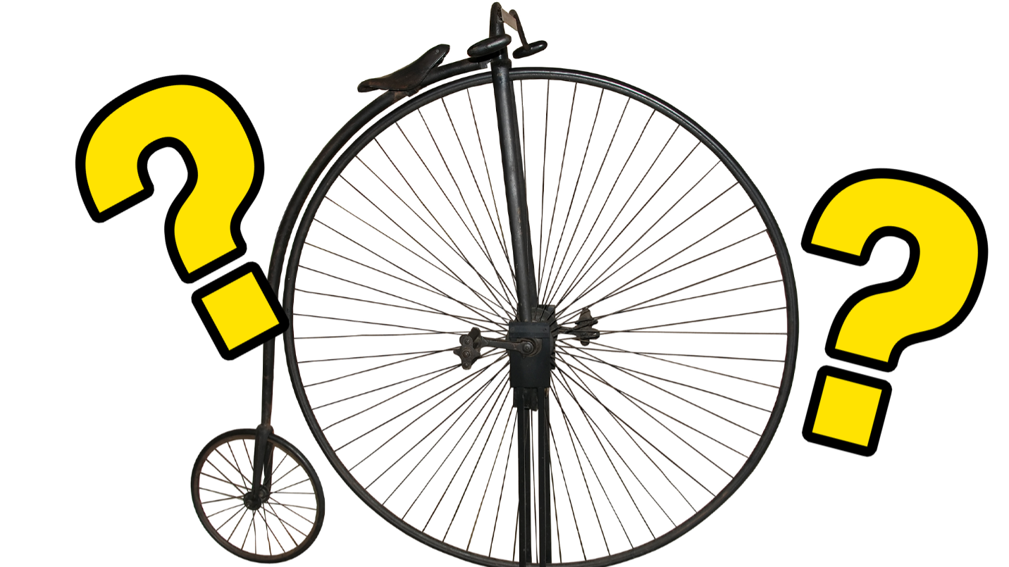 Penny farthing and question marks 