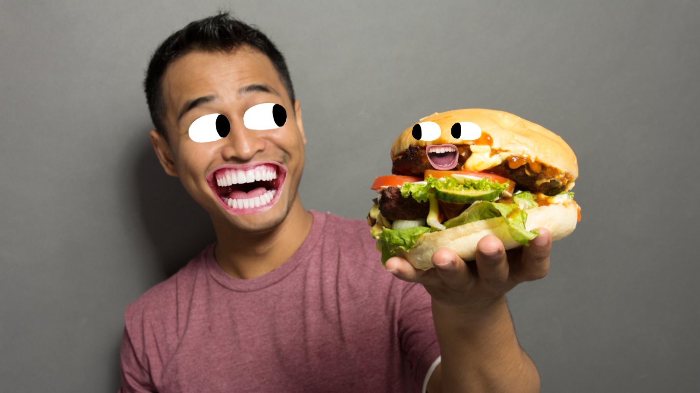 A man about to eat a hamburger