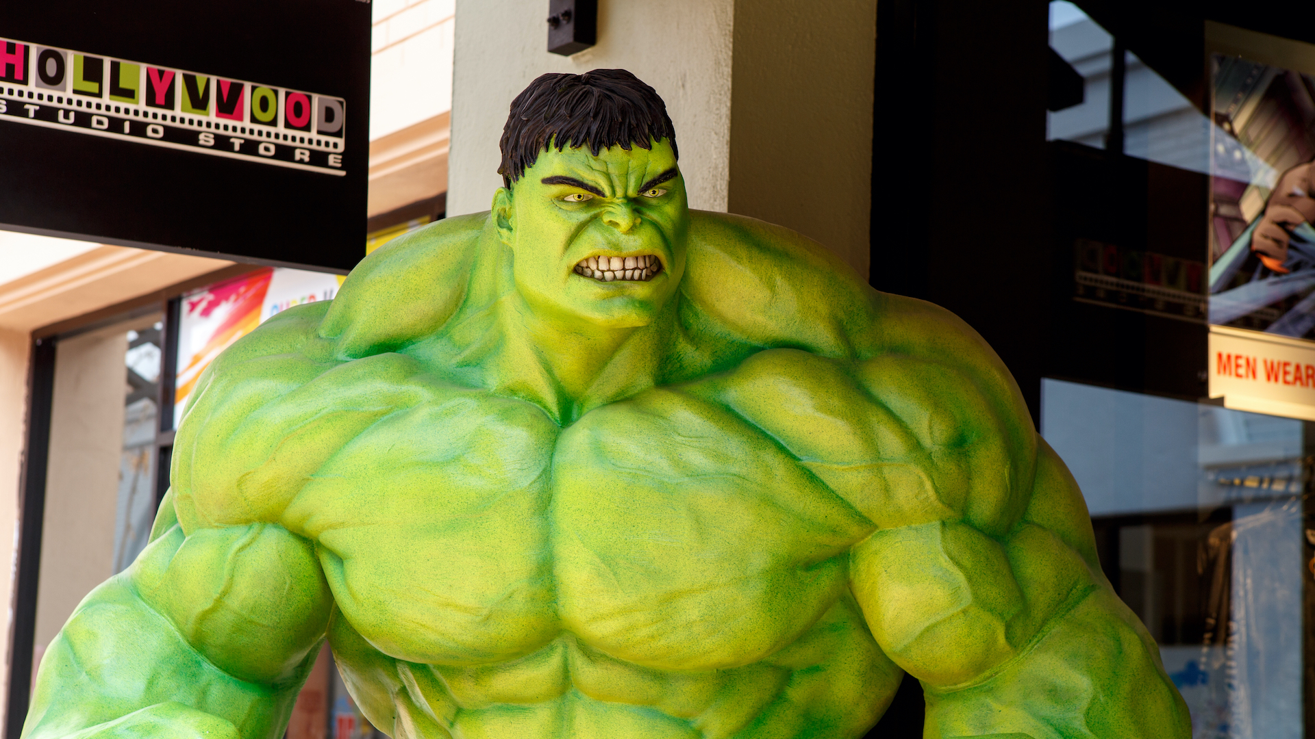A model of the Hulk standing outside of a shop