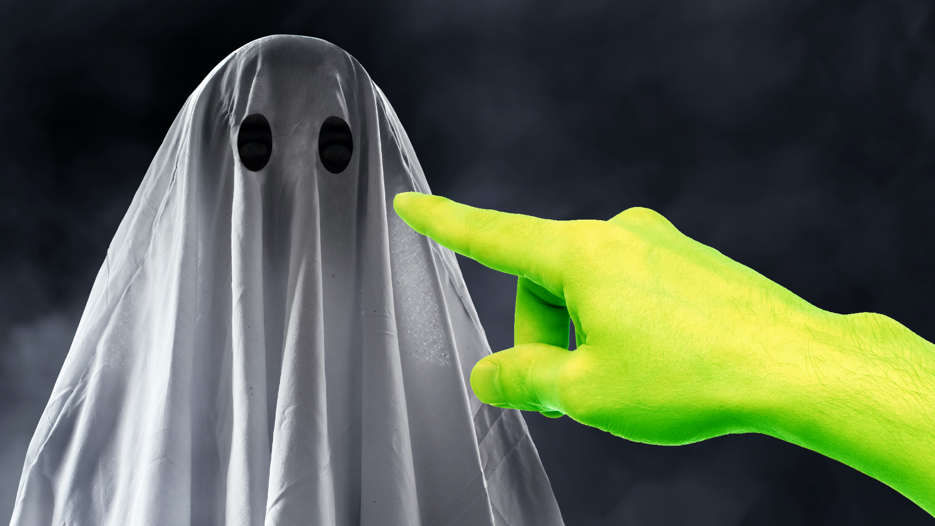 A green finger pointing at a ghost