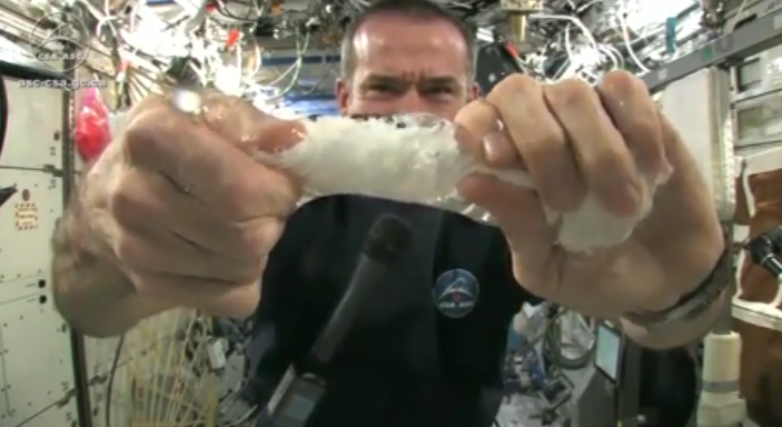 Wringing a wet cloth in space