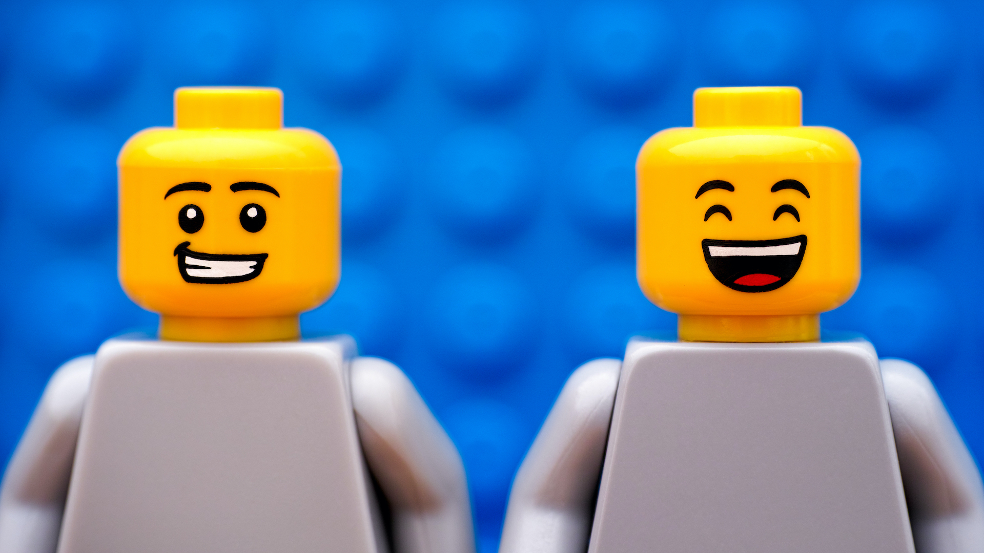 Two smiling LEGO characters