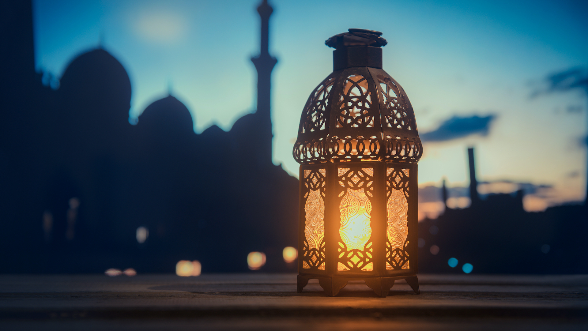 A serene mosque background with glowing lantern