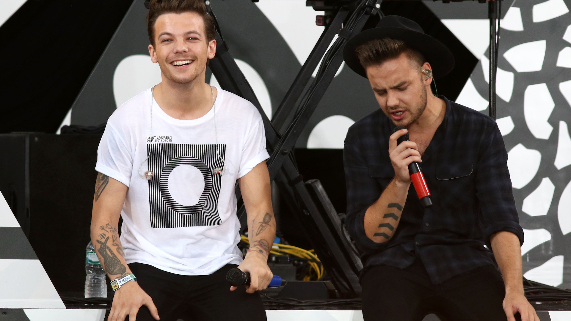 Liam Payne and Louis Tomlinson of One Direction perform on 'Good Morning America' in Central Park in New York City