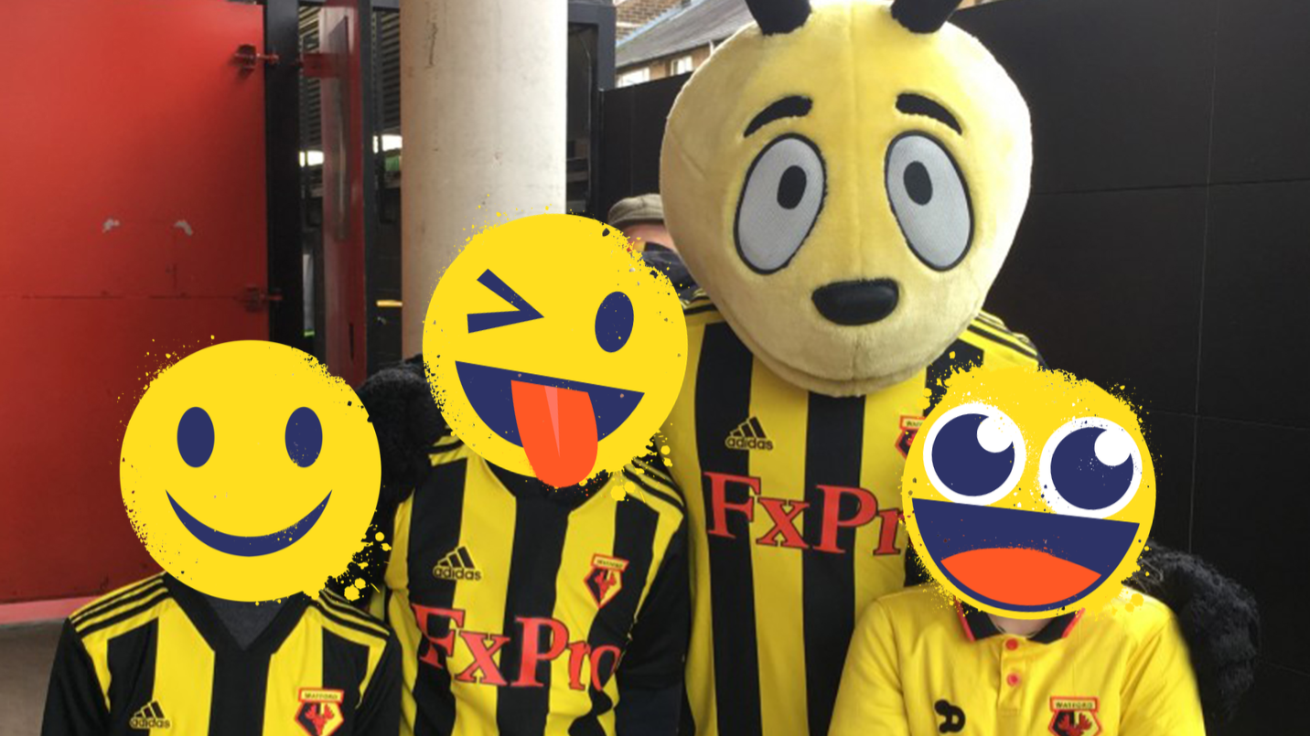 Watford's mascot and three fans