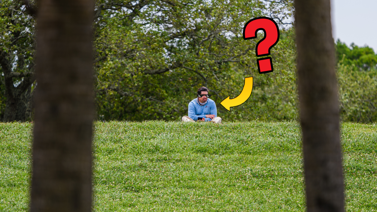 Man sitting alone on grass