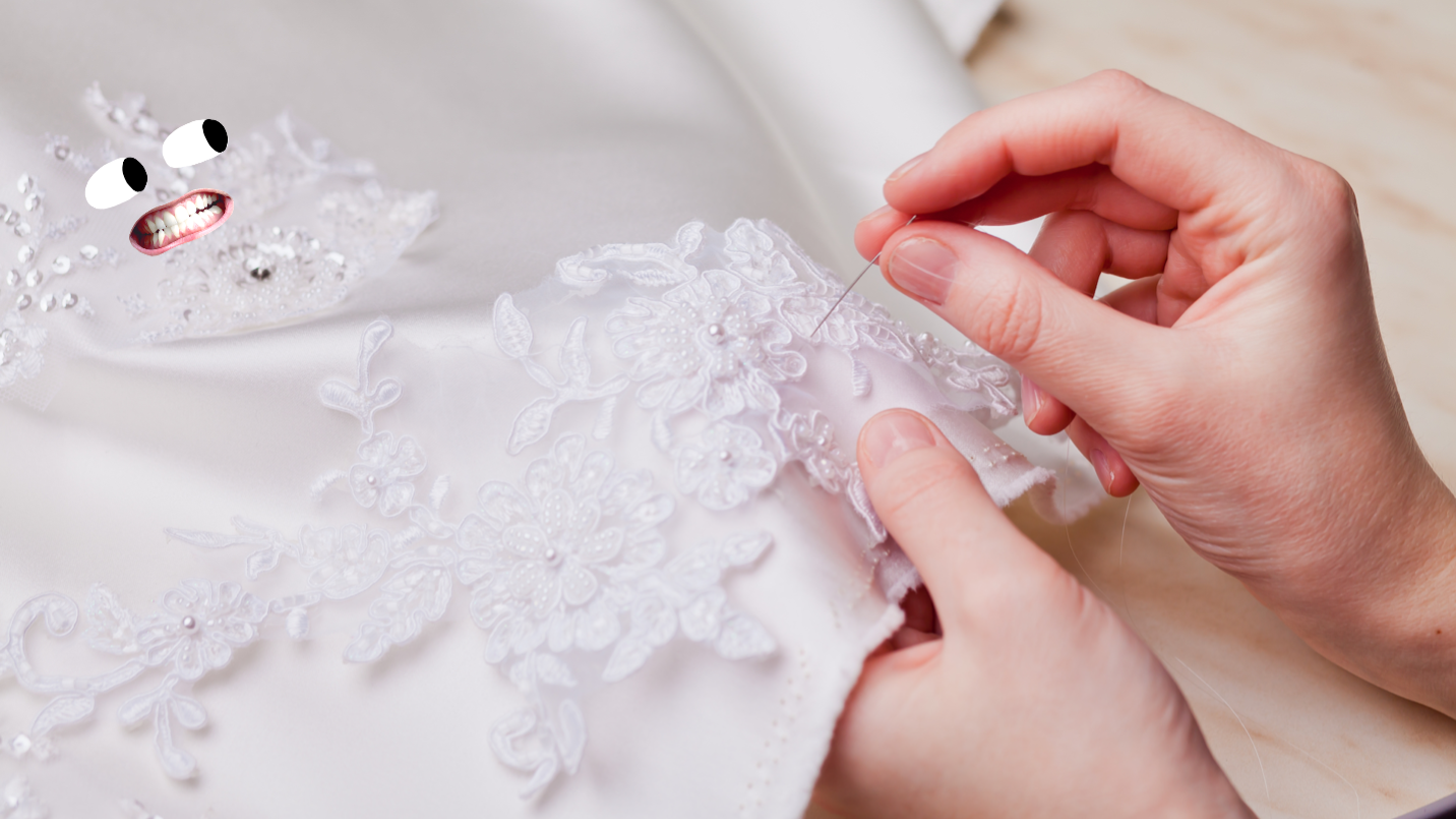 A dressmaker sews a hem on a skirt