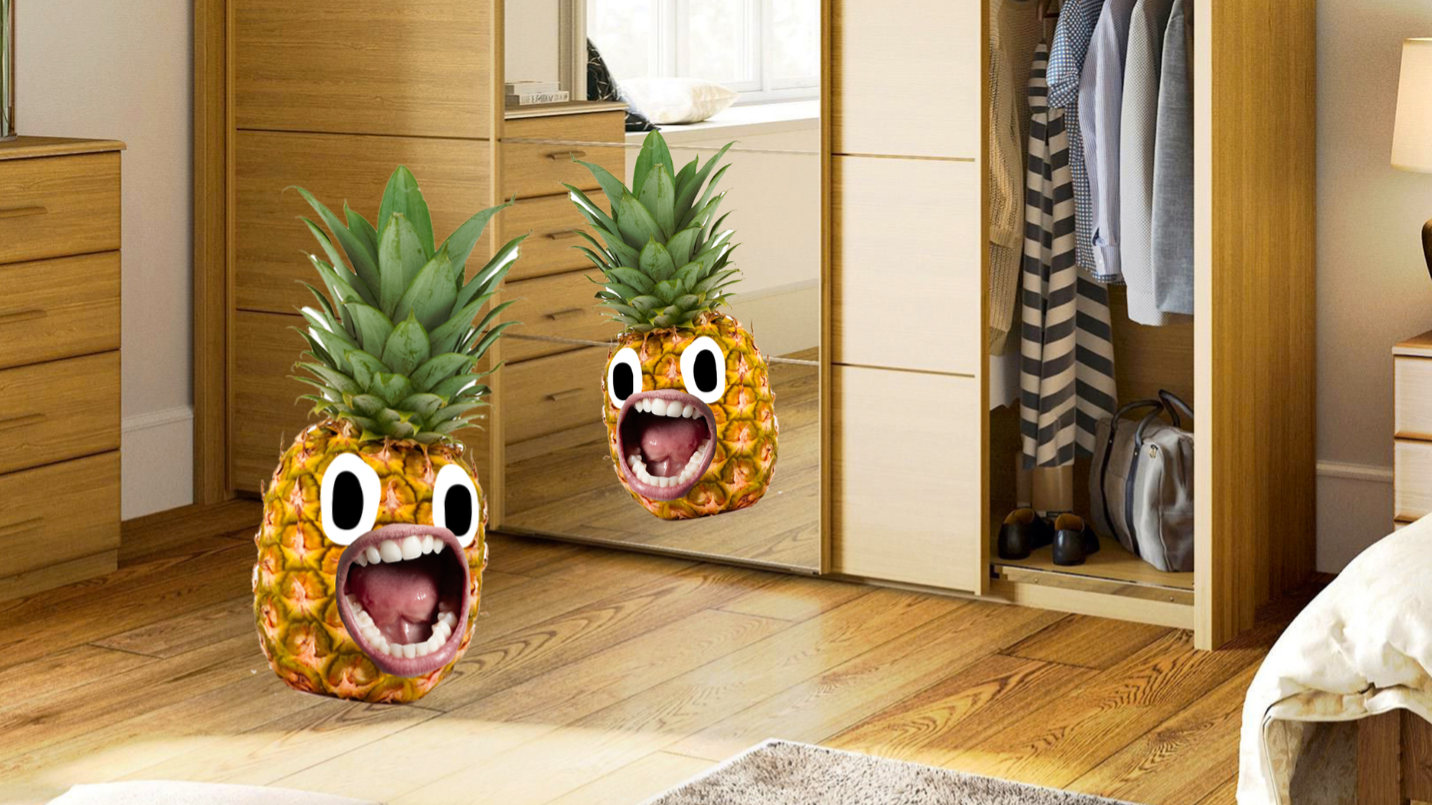 A pineapple looking in a mirror 