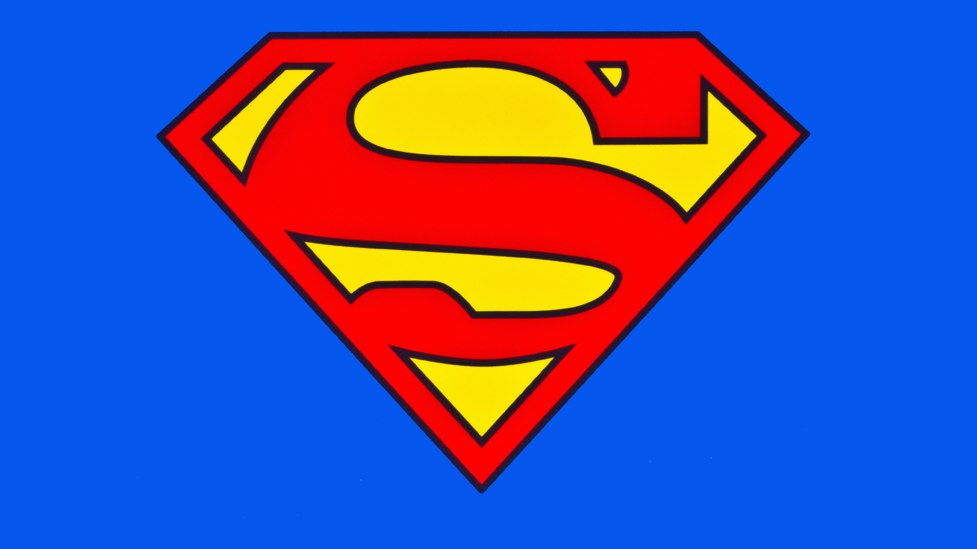 A stock image of a Superman logo on a blue background