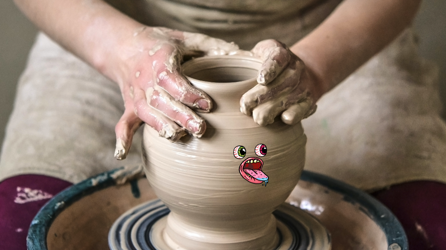 A potter working on a vase