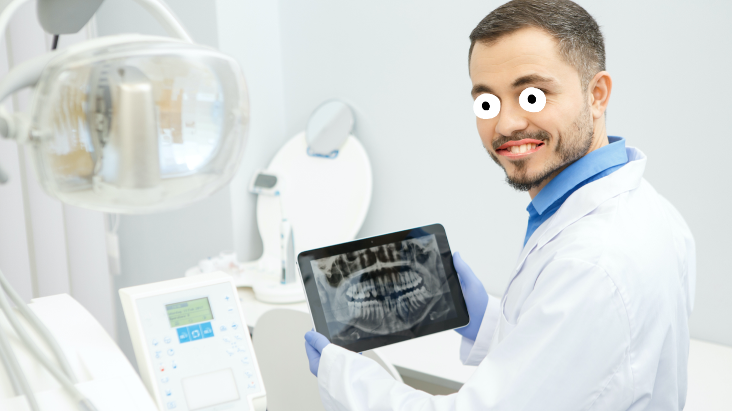 A dentist holding an x-ray