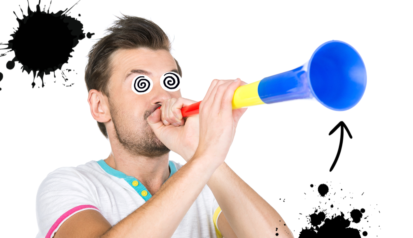 A man playing a vuvuzela