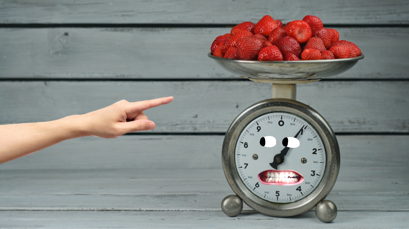 Kitchen scales and fresh strawberries