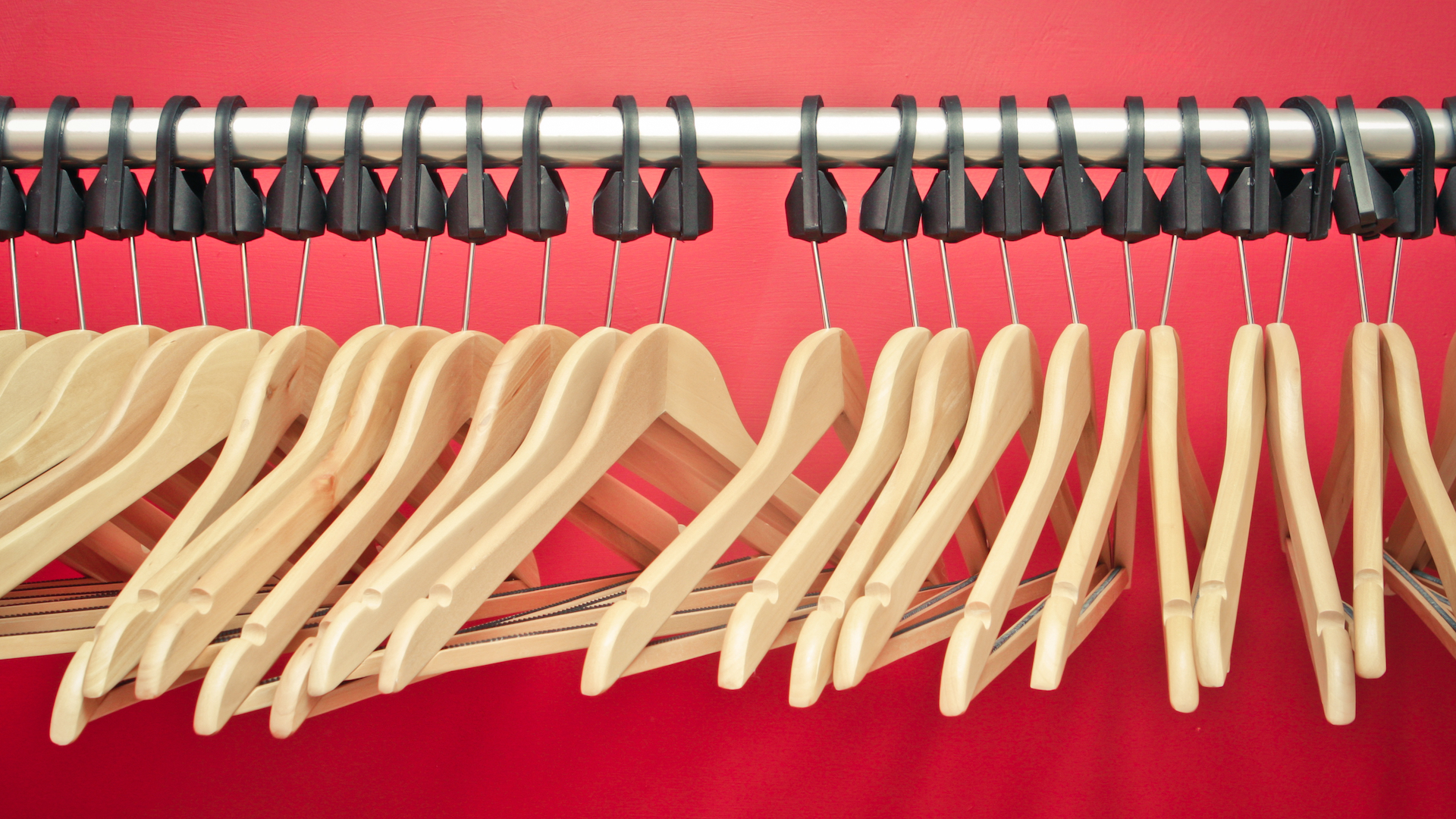 A clothing rail full of empty hangers
