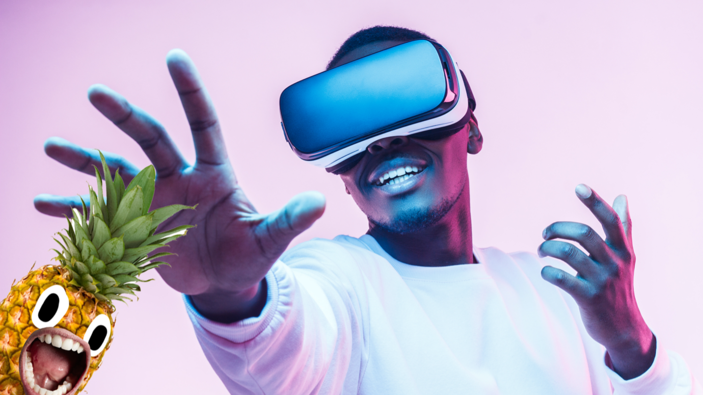 A man in VR goggles reaching out for a pineapple