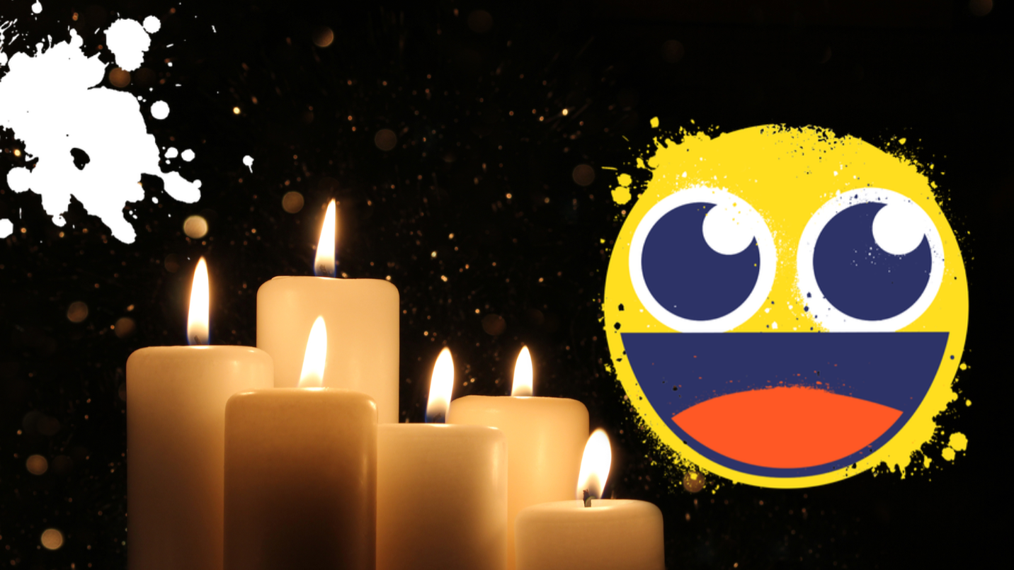 Candles and emoji on black background