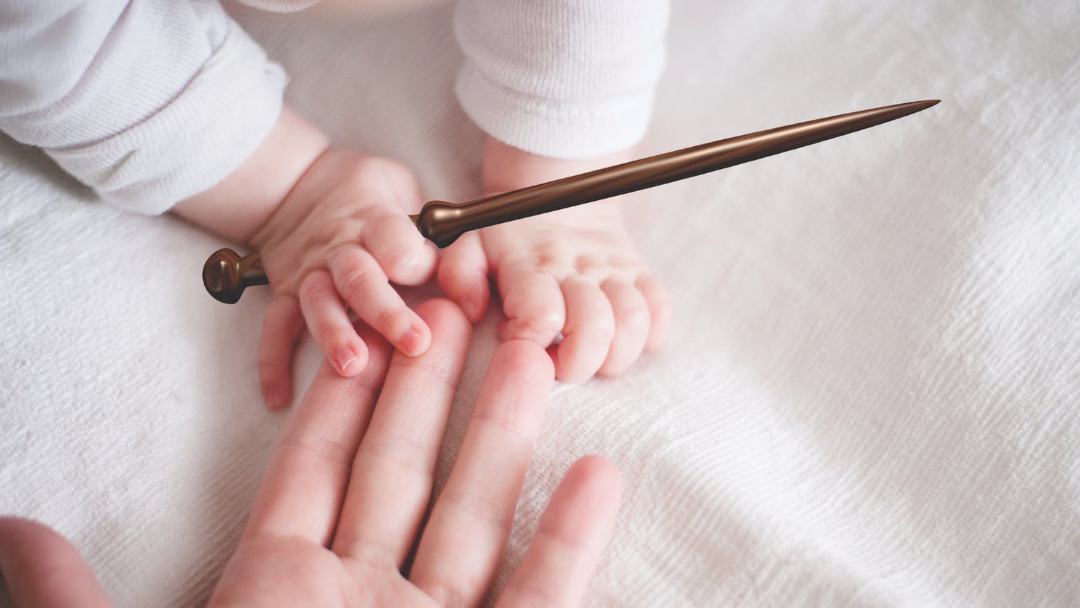 A baby holding a magic wand