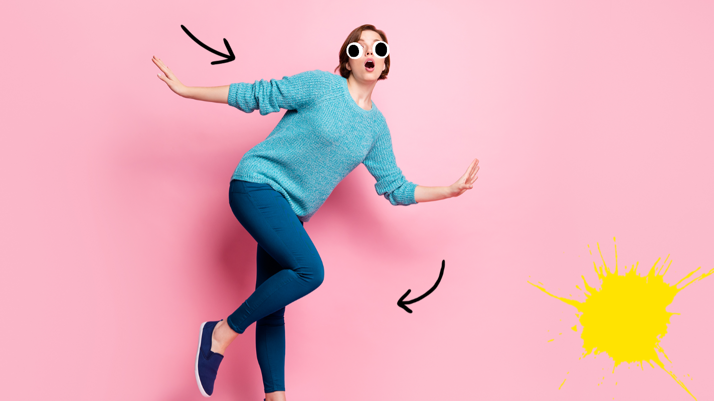 Woman tripping on pink background