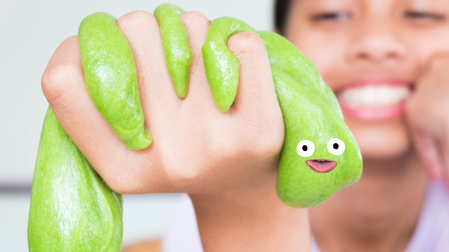 A woman holding a lump of slime