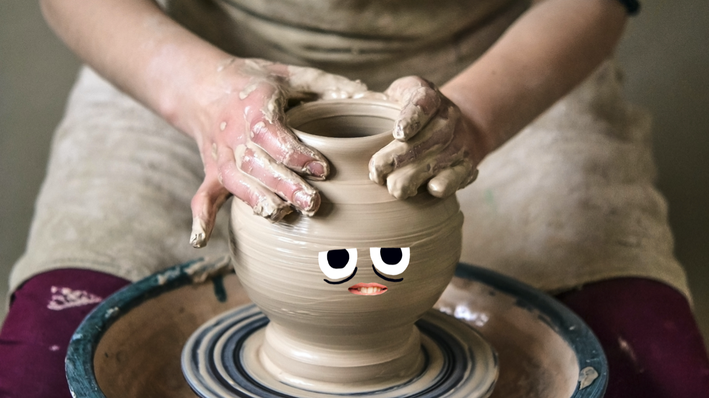 A person making a pottery vase