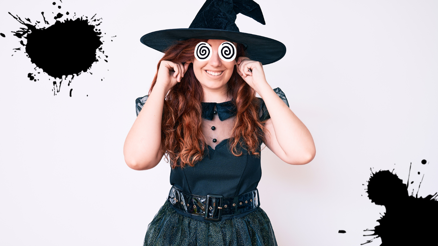 Woman dressed as a witch on white background