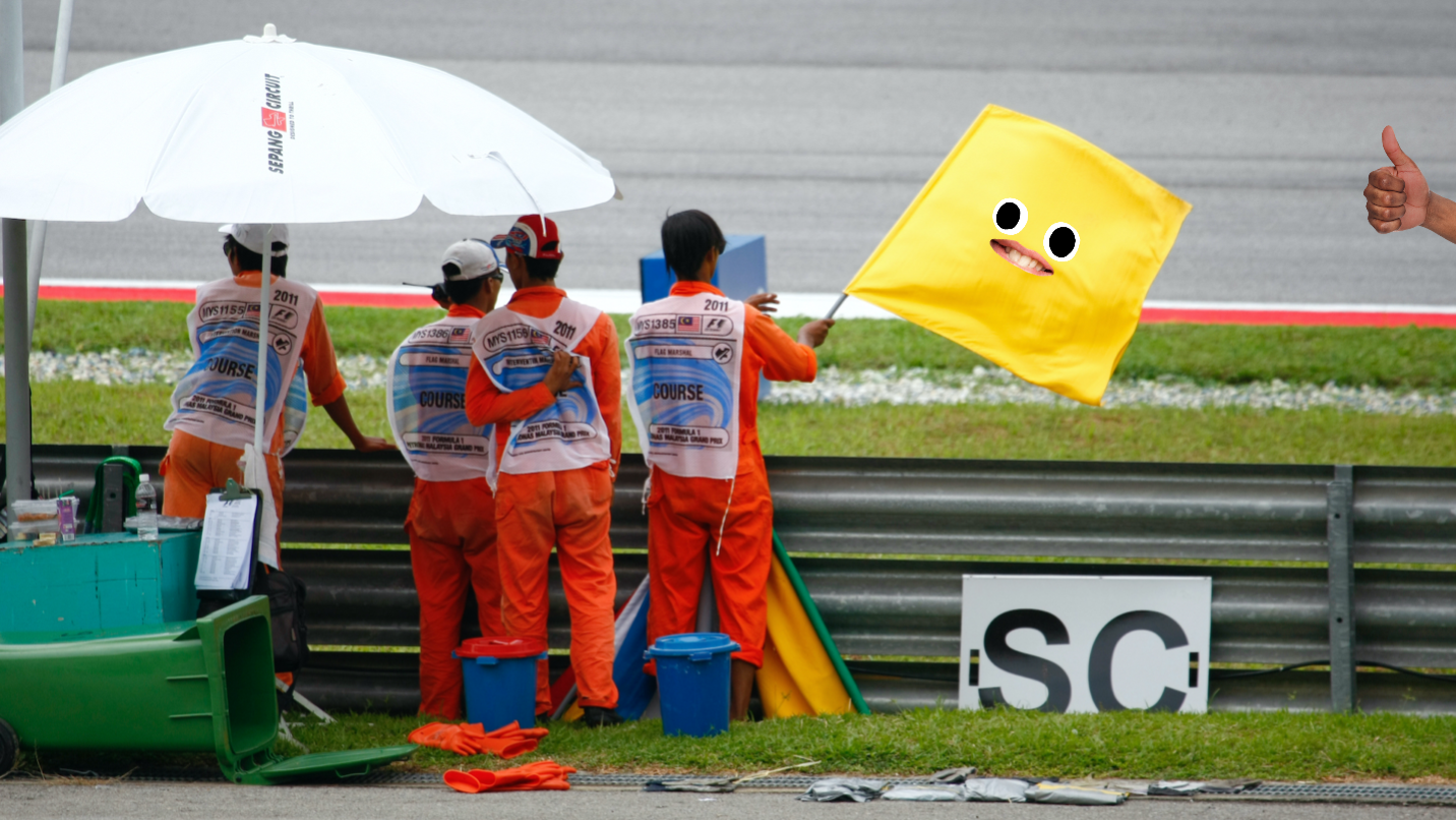 A yellow flag being waved at Formula 1 race