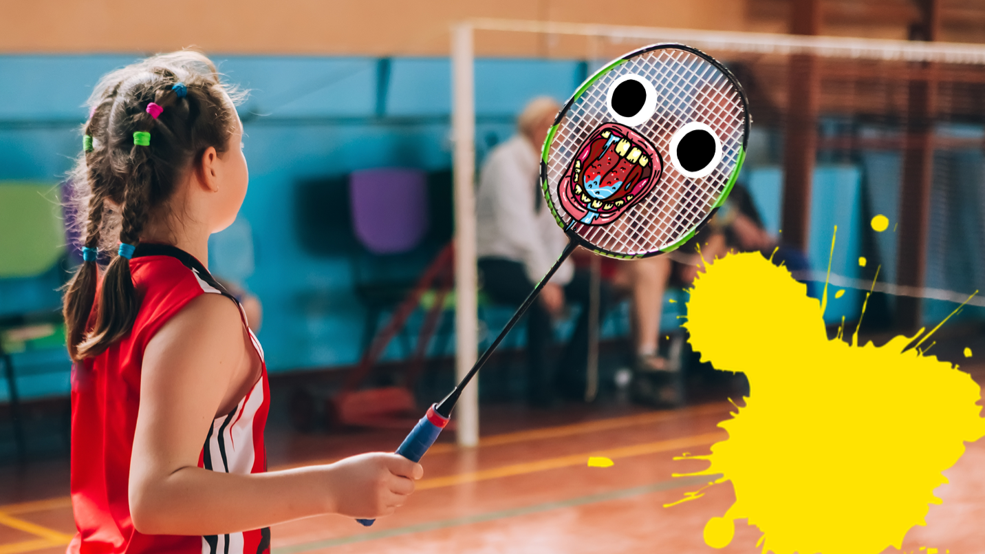 Girl holding racquet on badminton court