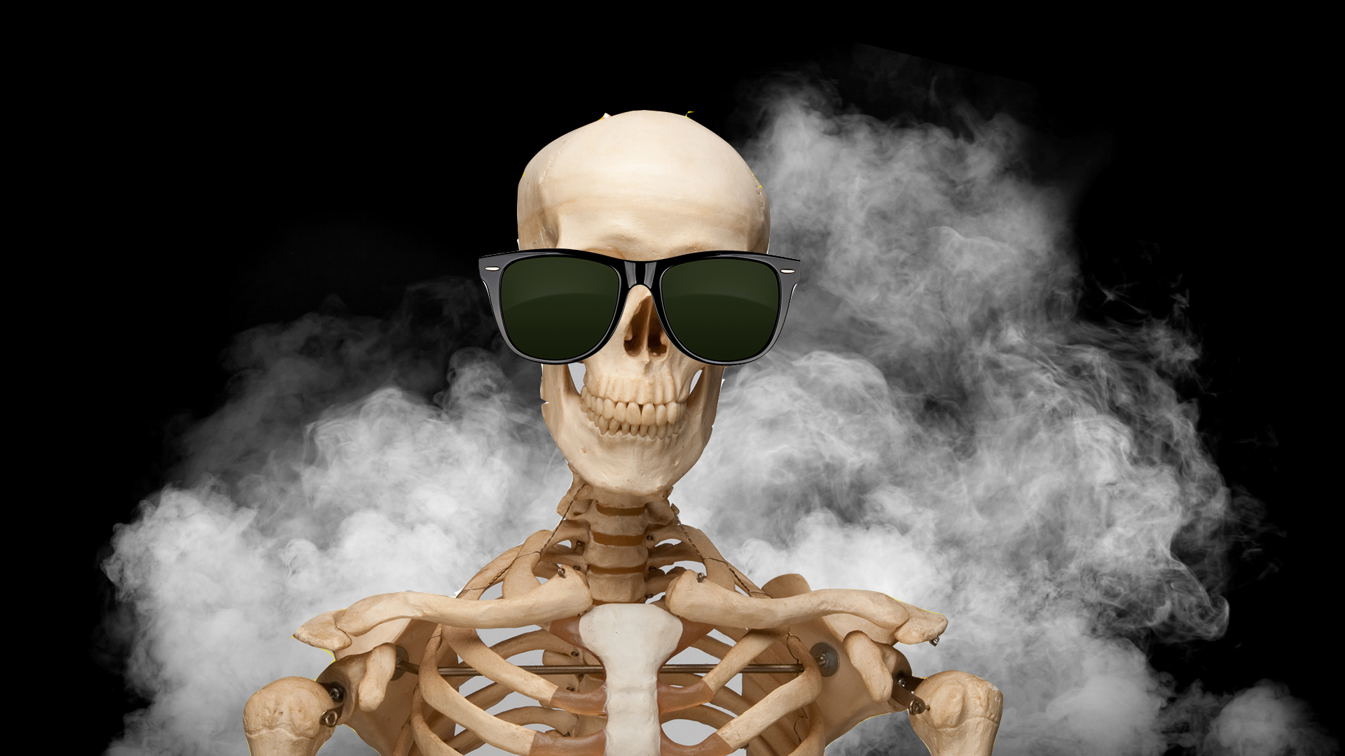 Grinning skeleton wearing dark sunglasses