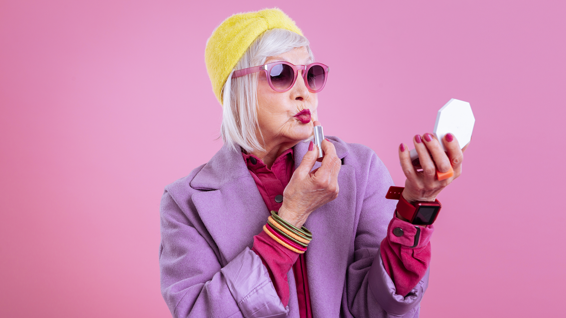A elderly lady dressed in cool clothes