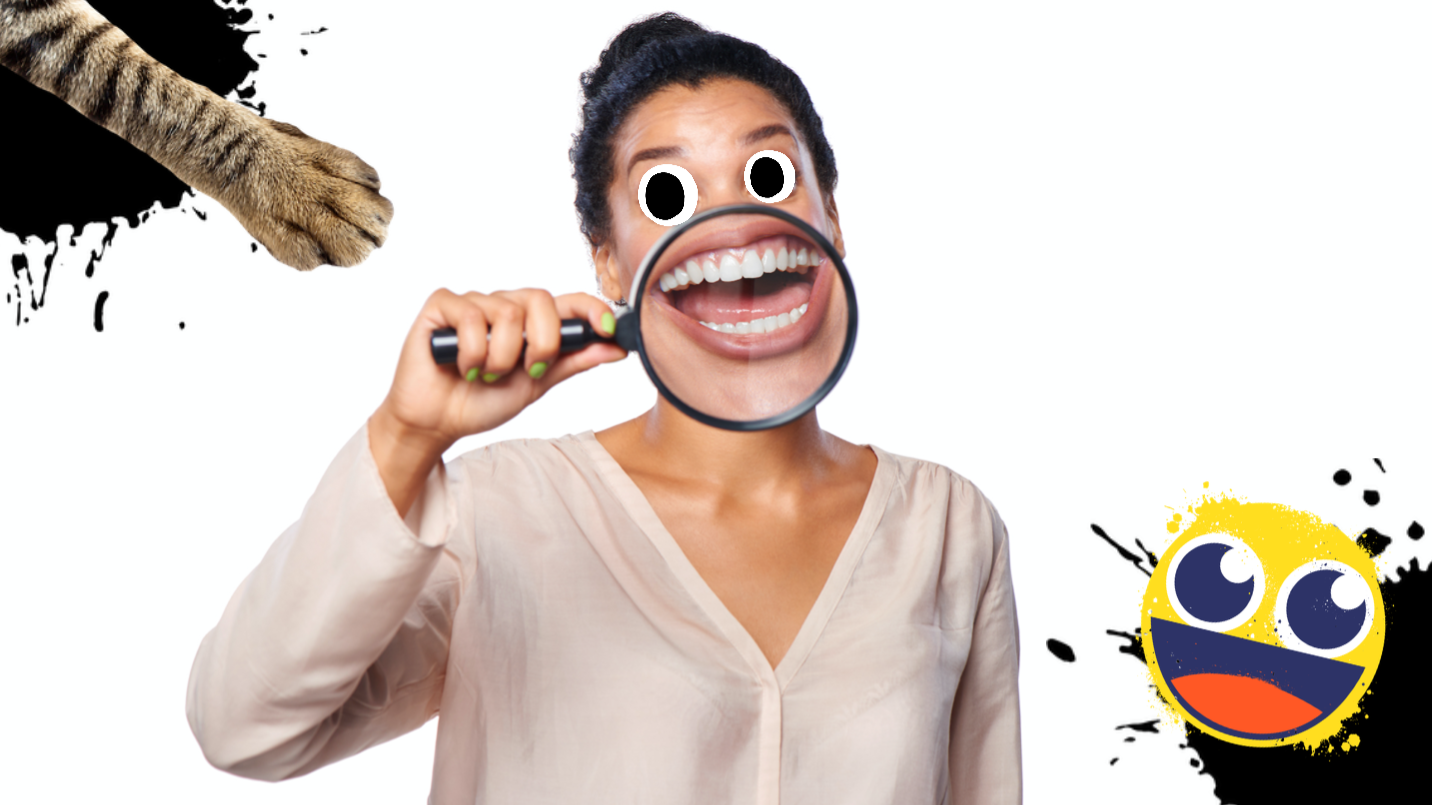 A woman smiling using a magnifying glass