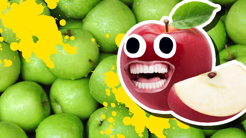 A smiling red apple in front of lots of green apples