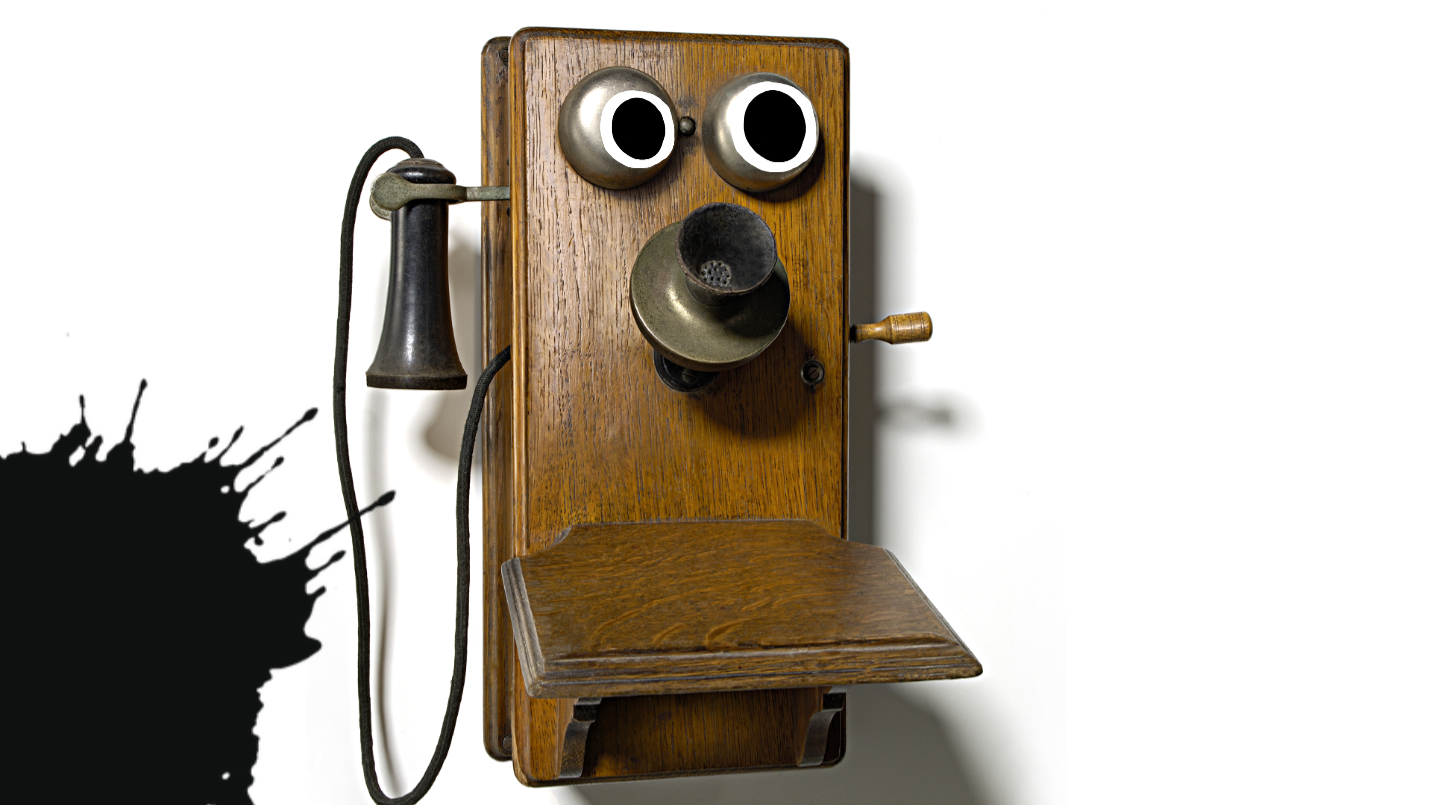 Old telephone with googly eyes