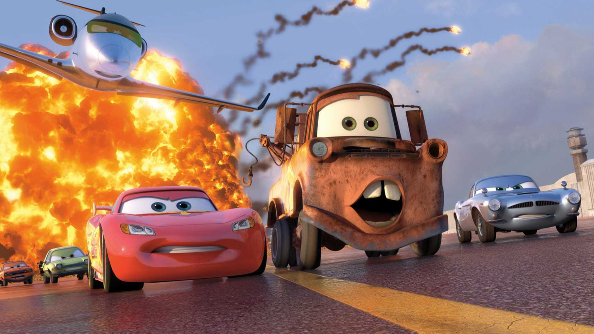 Lightning McQueen and Mater driving away from explosion 