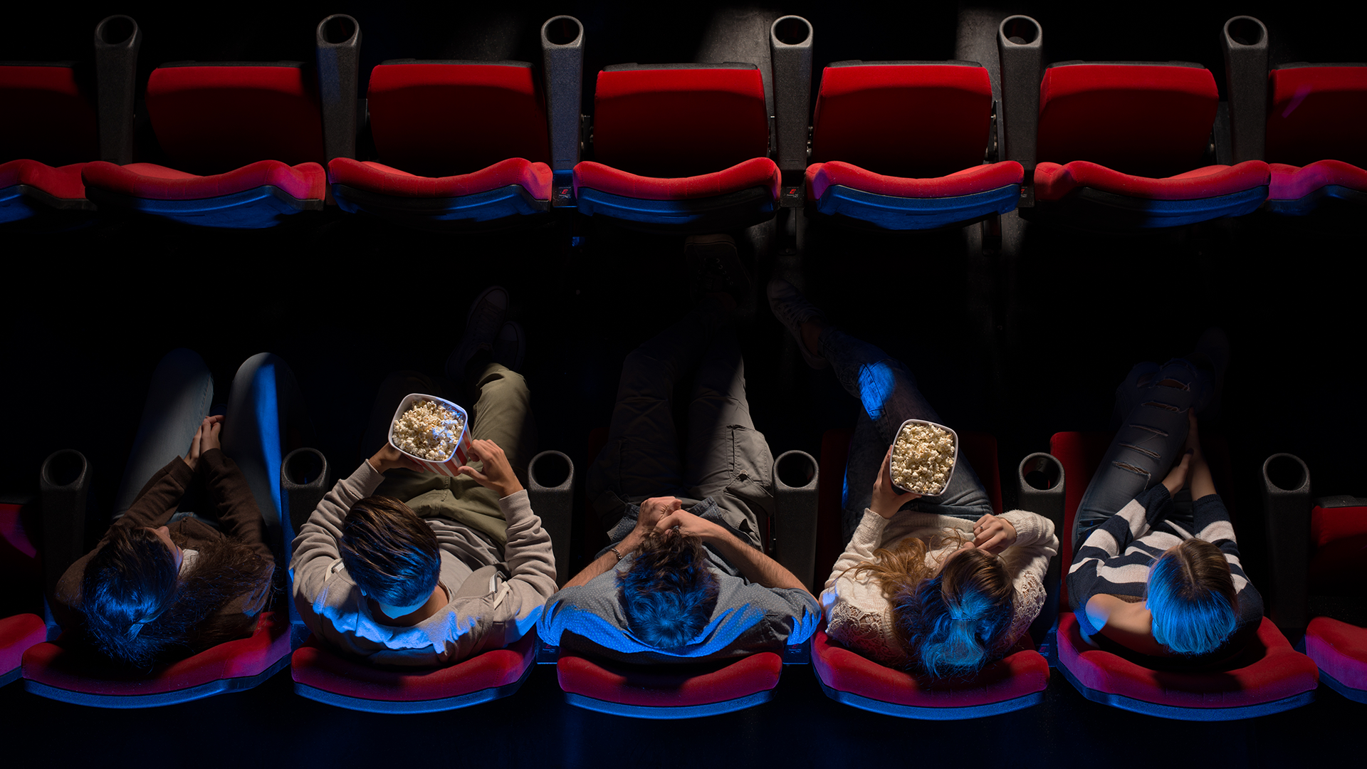 People in a cinema eating popcorn