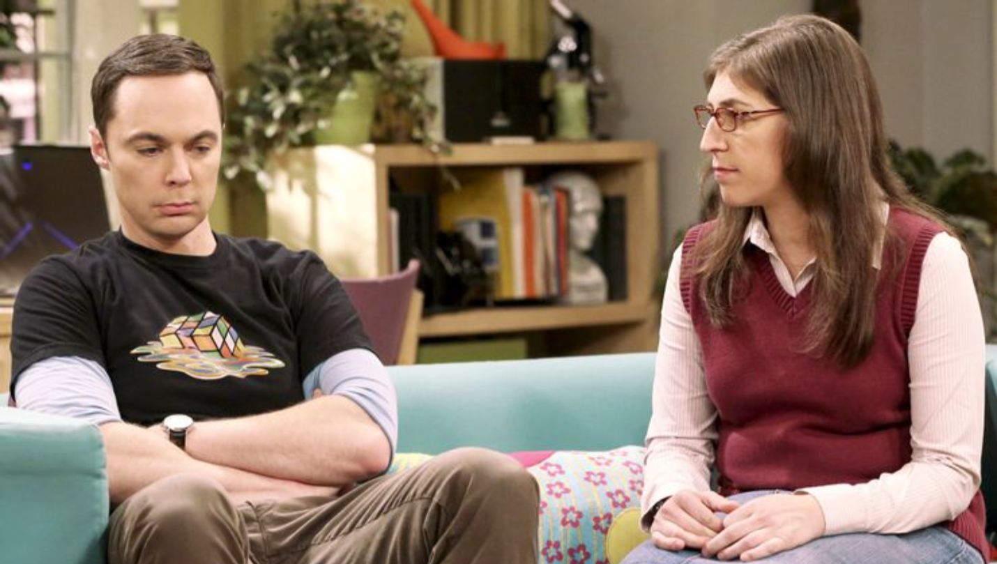Sheldon and Amy sitting on the couch