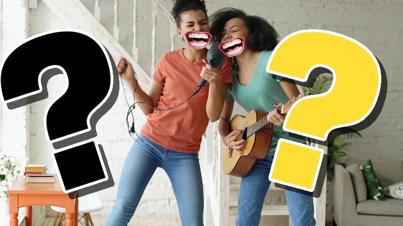 Two women singing in a living room